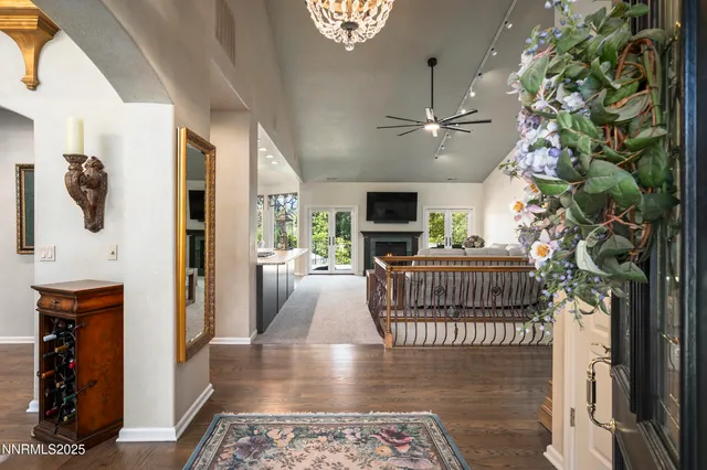 a view of livingroom with furniture fireplace and windows