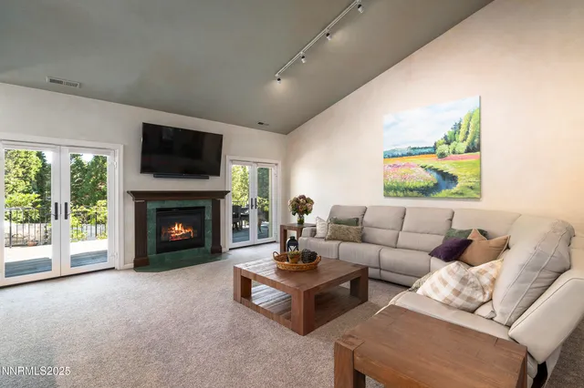 a living room with furniture fireplace and a flat screen tv