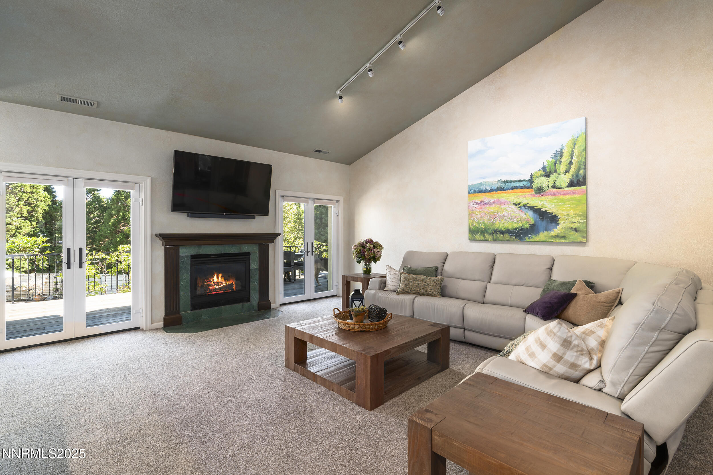 1762 Belford Road Reno, NV 89509 - Photo 7 of 70 a living room with furniture a flat screen tv and a fireplace