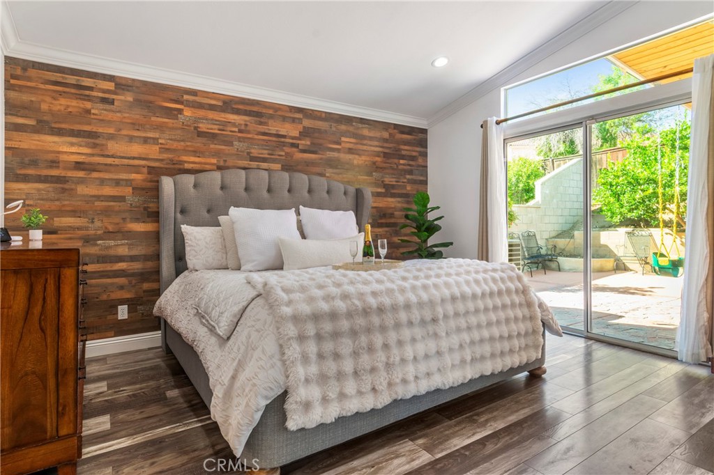 16366 West Sun Canyon Street Riverside, CA 92503 - Photo 12 of 21 a bedroom with a bed and large windows