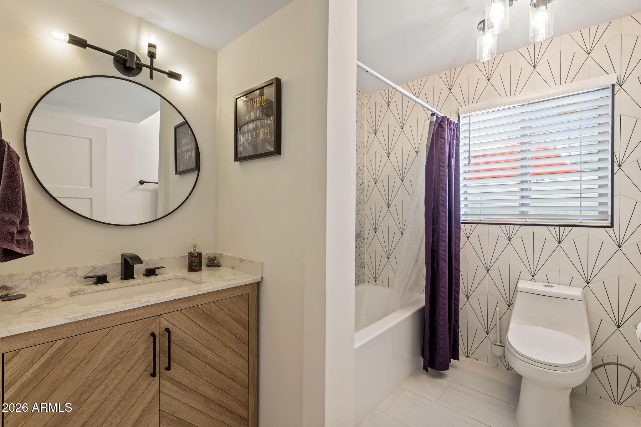 3901 North 19th Street Phoenix, AZ 85016 - Photo 14 of 20 a bathroom with a sink a toilet and a mirror