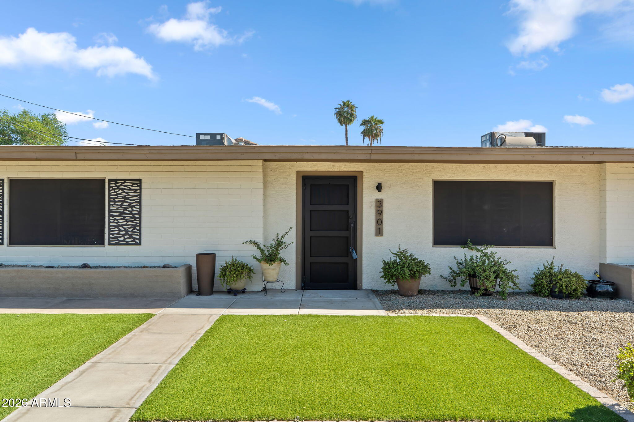3901 North 19th Street Phoenix, AZ 85016 - Photo 2 of 20 a view of a house with backyard and sitting area