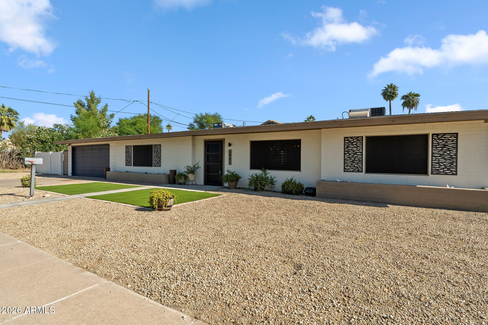 3901 North 19th Street Phoenix, AZ 85016 - Photo 3 of 20 a view of a house with a swimming pool and sitting area