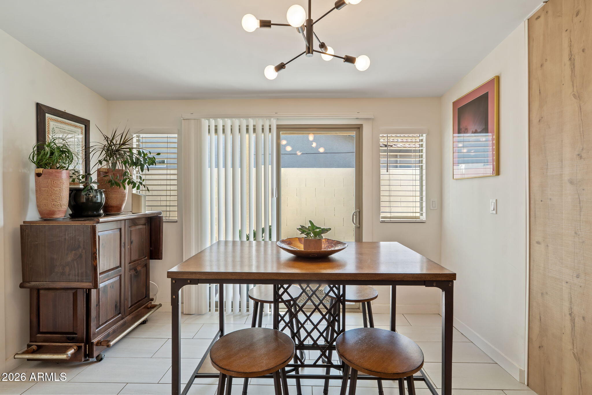 3901 North 19th Street Phoenix, AZ 85016 - Photo 8 of 20 a view of a dining room with furniture window and wooden floor