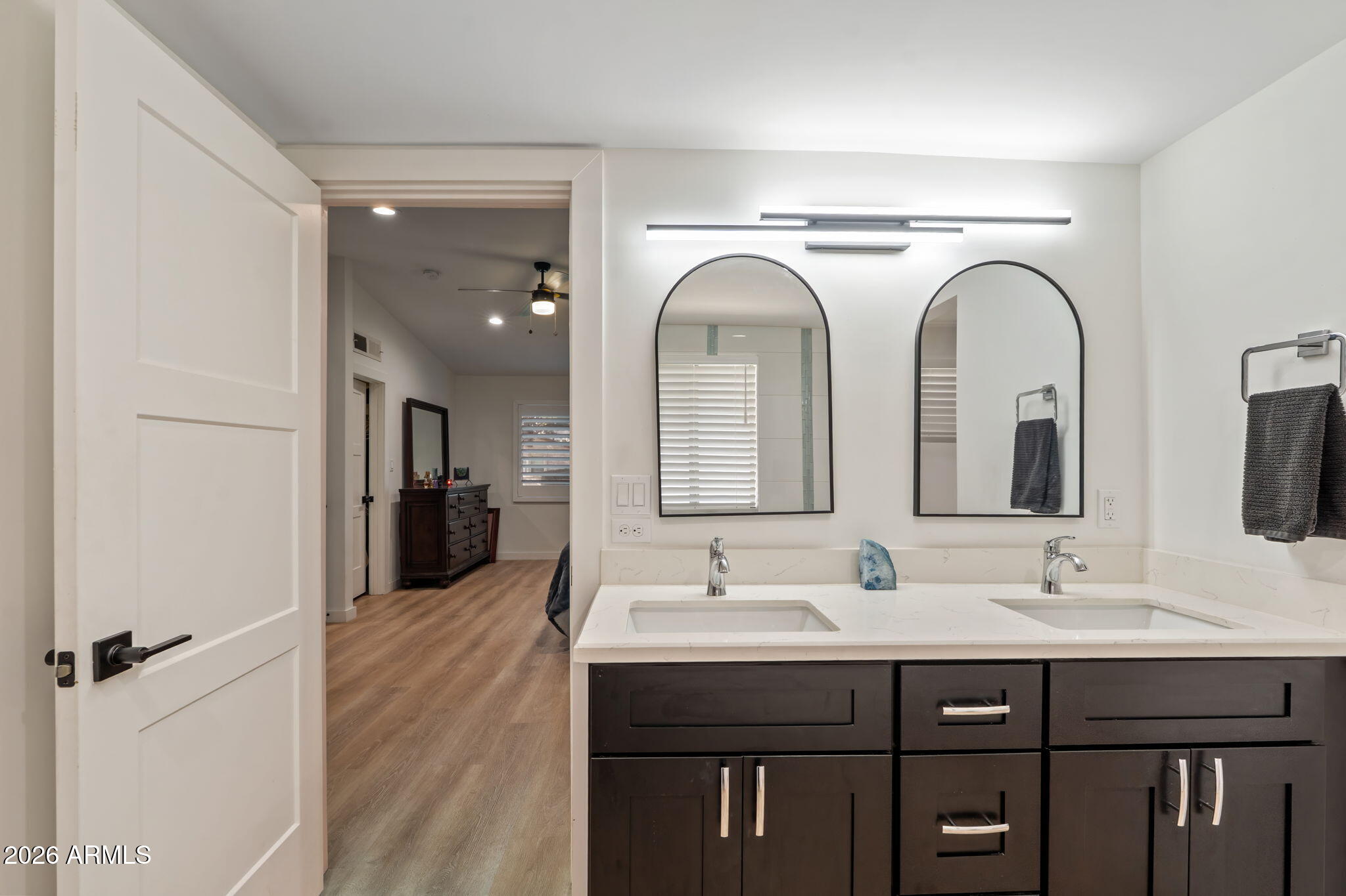 3901 North 19th Street Phoenix, AZ 85016 - Photo 10 of 20 a bathroom with a double vanity sink and a mirror