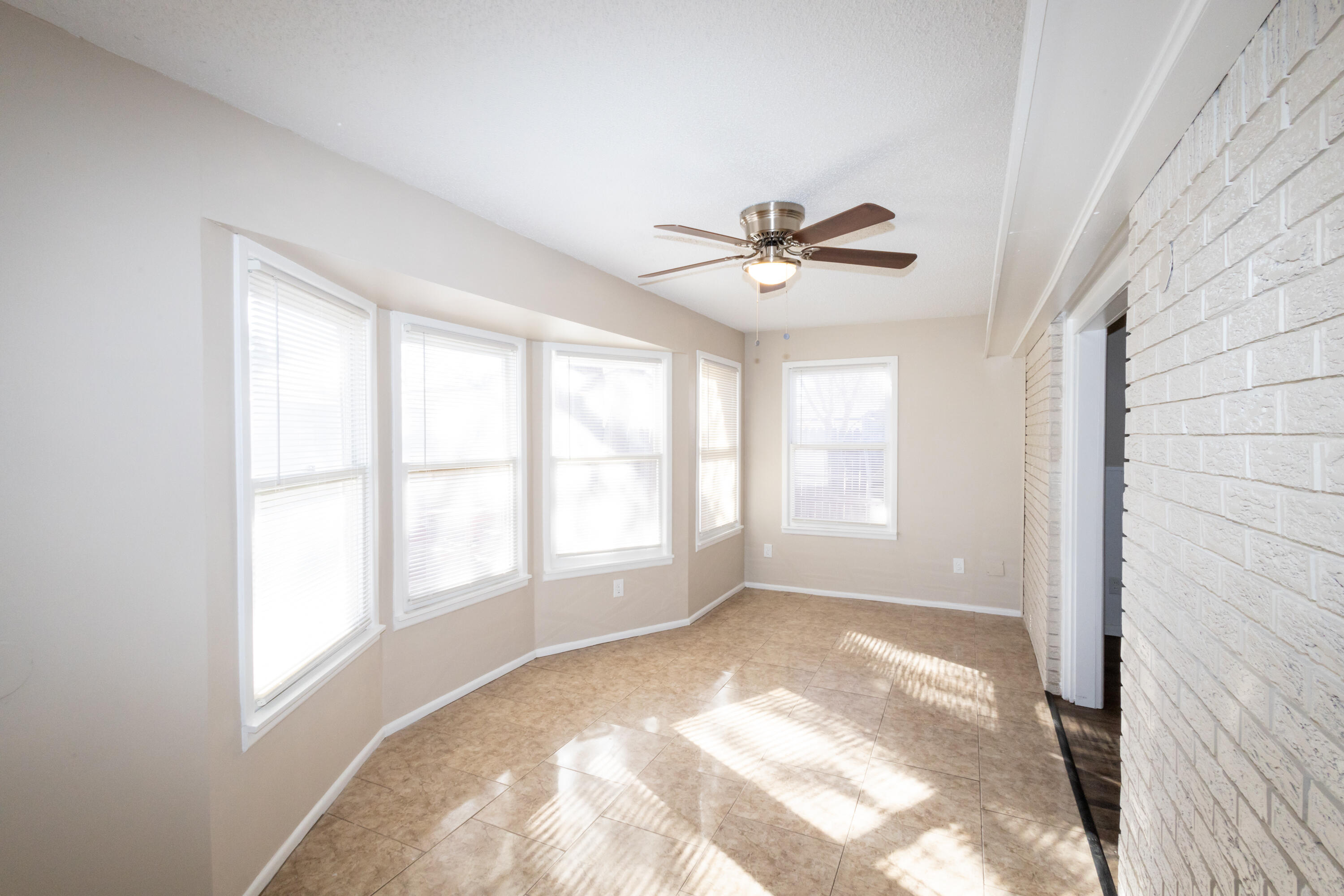 5323 31st Street Lubbock, TX 79407 - Photo 11 of 28 a view of an empty room with a window