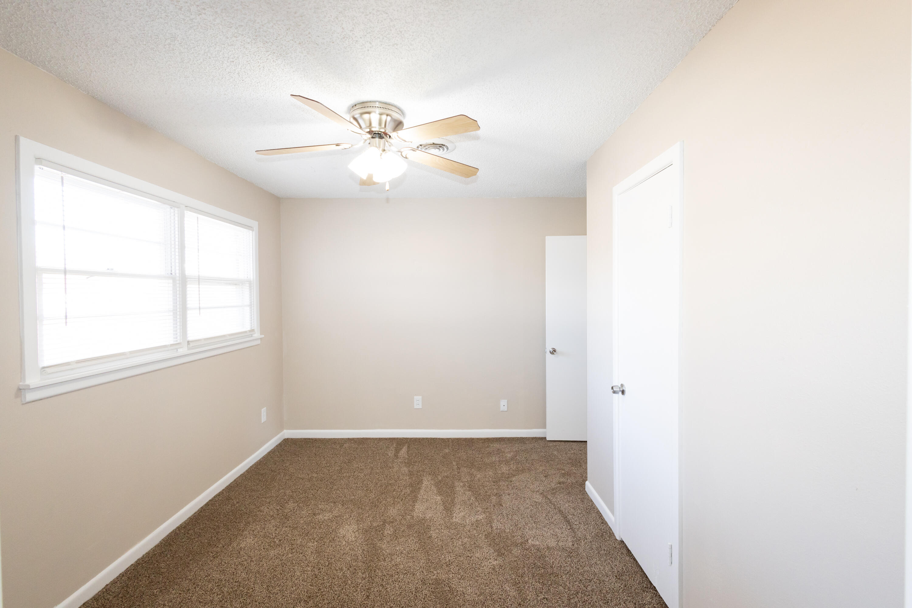 5323 31st Street Lubbock, TX 79407 - Photo 17 of 28 a view of an empty room with a window
