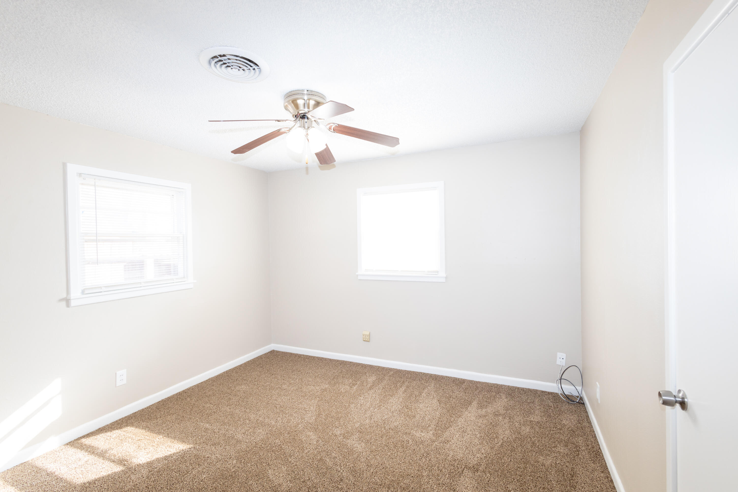 5323 31st Street Lubbock, TX 79407 - Photo 19 of 28 a view of an empty room with a window