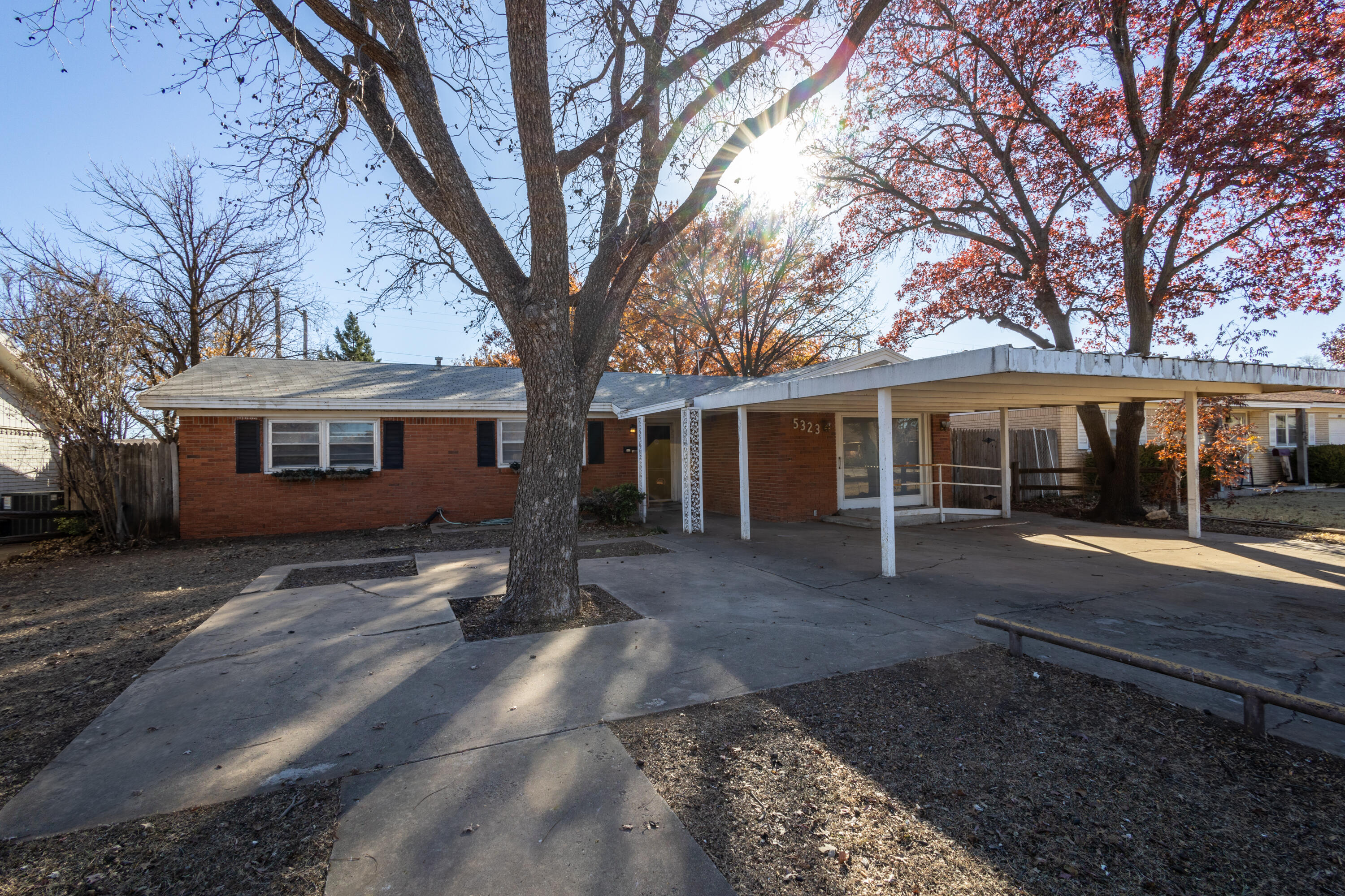 5323 31st Street Lubbock, TX 79407 - Photo 2 of 28 a front view of a house with a yard