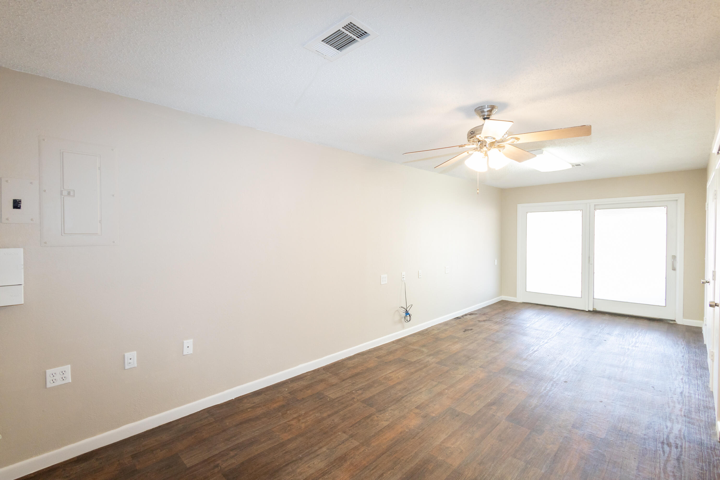 5323 31st Street Lubbock, TX 79407 - Photo 22 of 28 a view of an empty room with a chandelier fan
