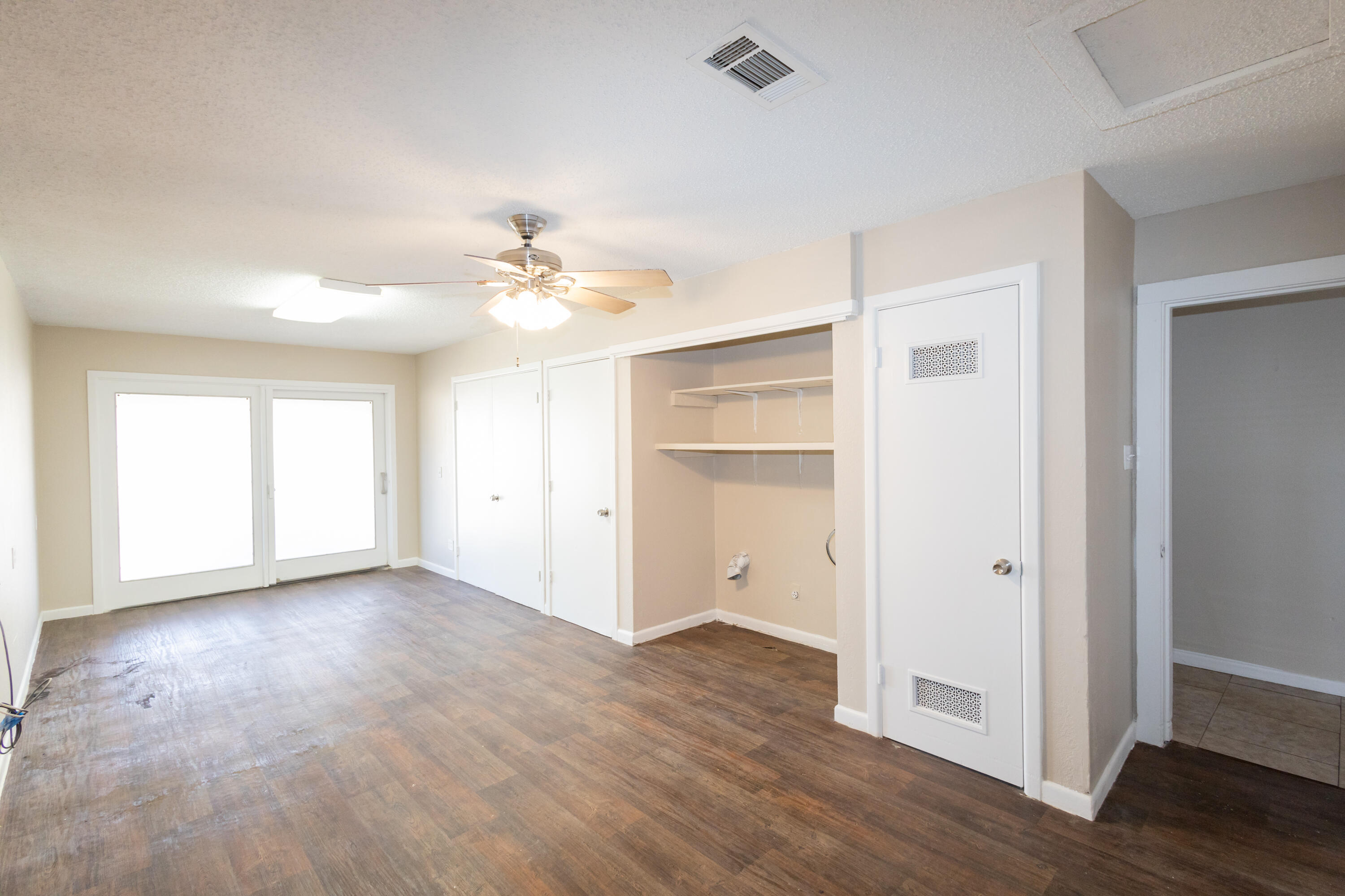 5323 31st Street Lubbock, TX 79407 - Photo 23 of 28 wooden floor in an empty room with a window