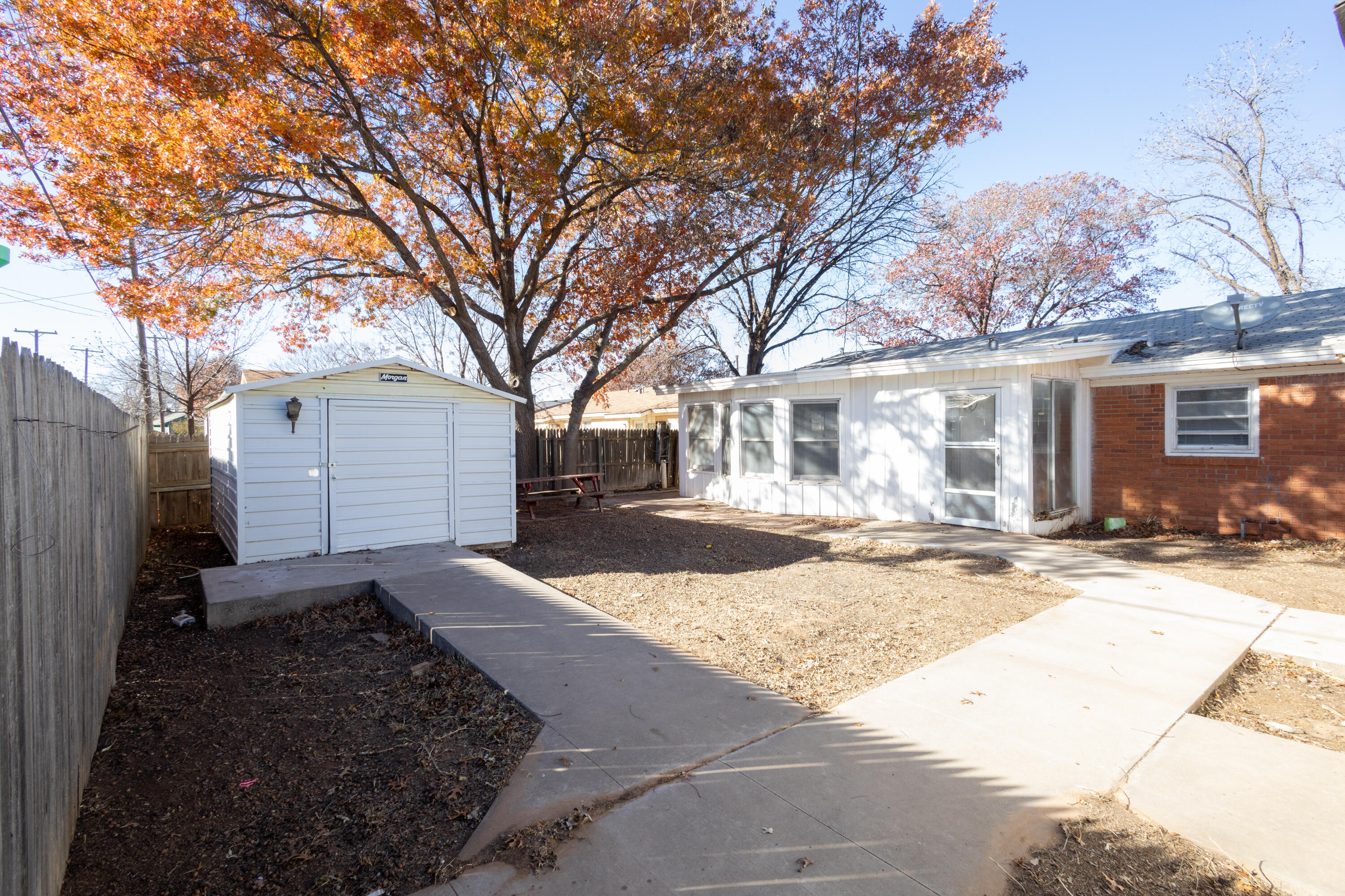5323 31st Street Lubbock, TX 79407 - Photo 25 of 28 a view of a house with a yard covered in snow