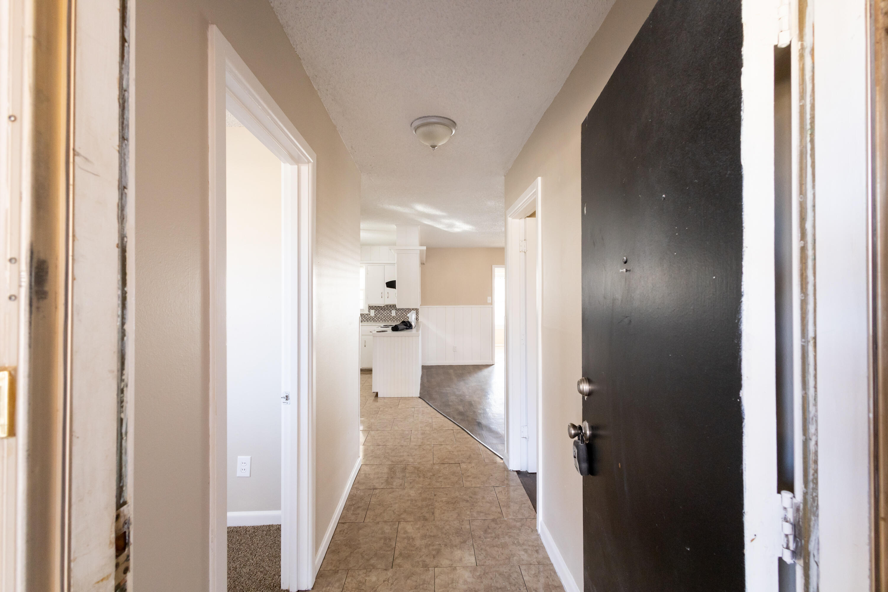5323 31st Street Lubbock, TX 79407 - Photo 3 of 28 a view of a bathroom from a hallway