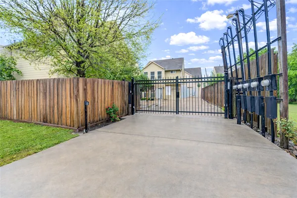 a view of a wrought iron fences in front of house
