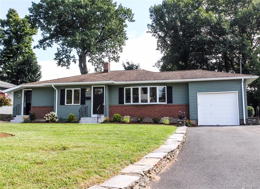 275 Reservoir Road Newington, CT 06111 - Photo 1 of 1 a front view of a house with a yard and garage