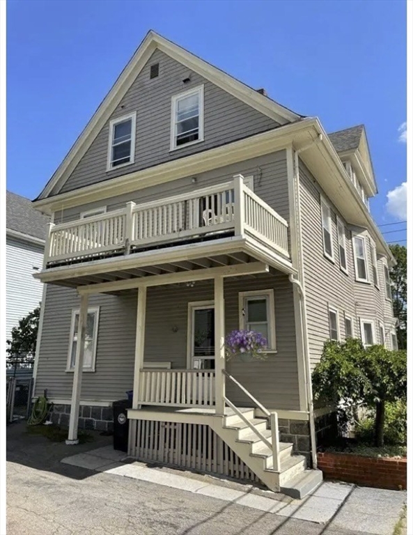168 Brook Road, Unit 1 Milton, MA 02186 - Photo 1 of 13 a front view of a house