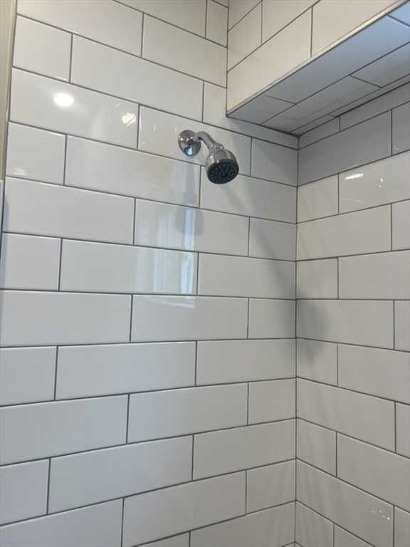 168 Brook Road, Unit 1 Milton, MA 02186 - Photo 2 of 13 a bathroom with a shower