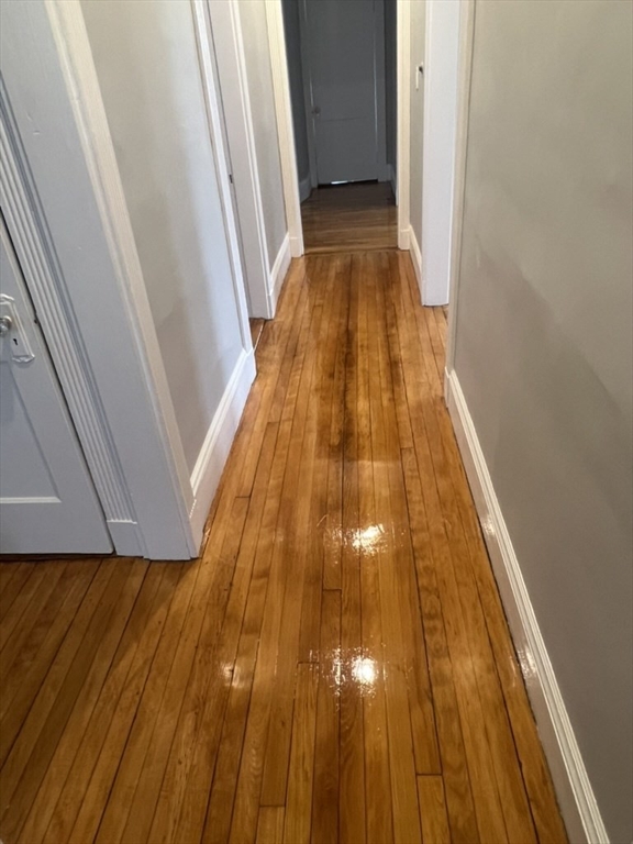 168 Brook Road, Unit 1 Milton, MA 02186 - Photo 10 of 13 a view of wooden floor