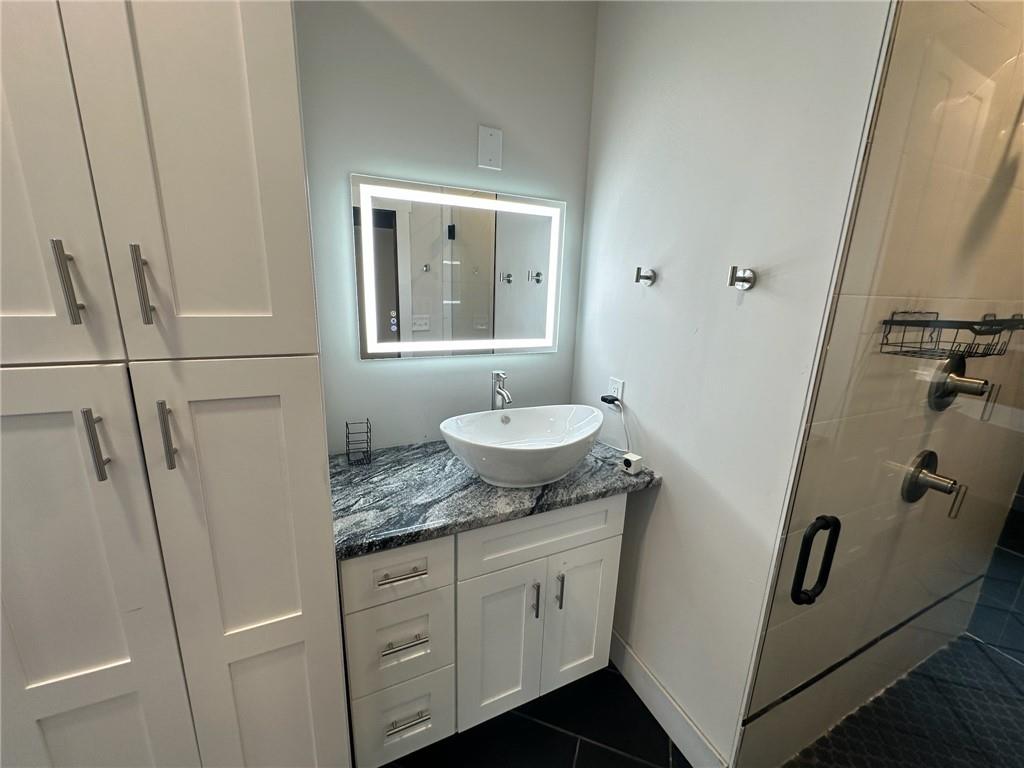 1001 Bailey Road Rome, GA 30161 - Photo 28 of 44 a bathroom with a granite countertop sink toilet and shower