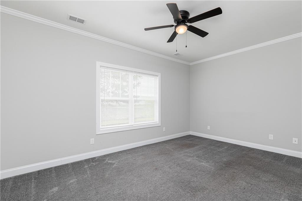 59 Calloway Lane Cartersville, GA 30120 - Photo 14 of 29 an empty room with a window and a fan