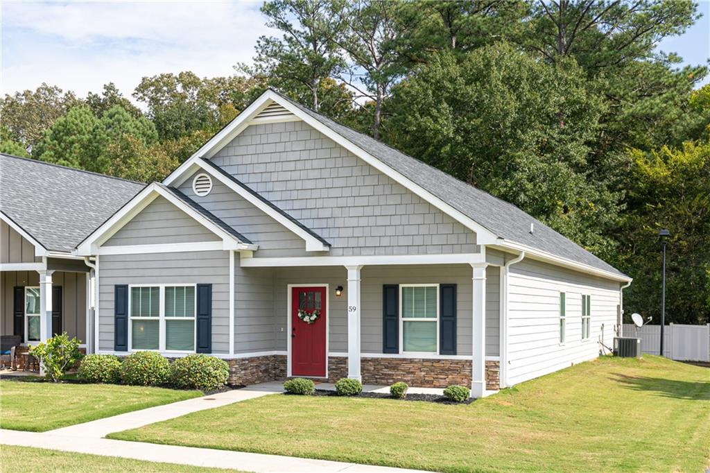 59 Calloway Lane Cartersville, GA 30120 - Photo 24 of 29 a front view of a house with a garden