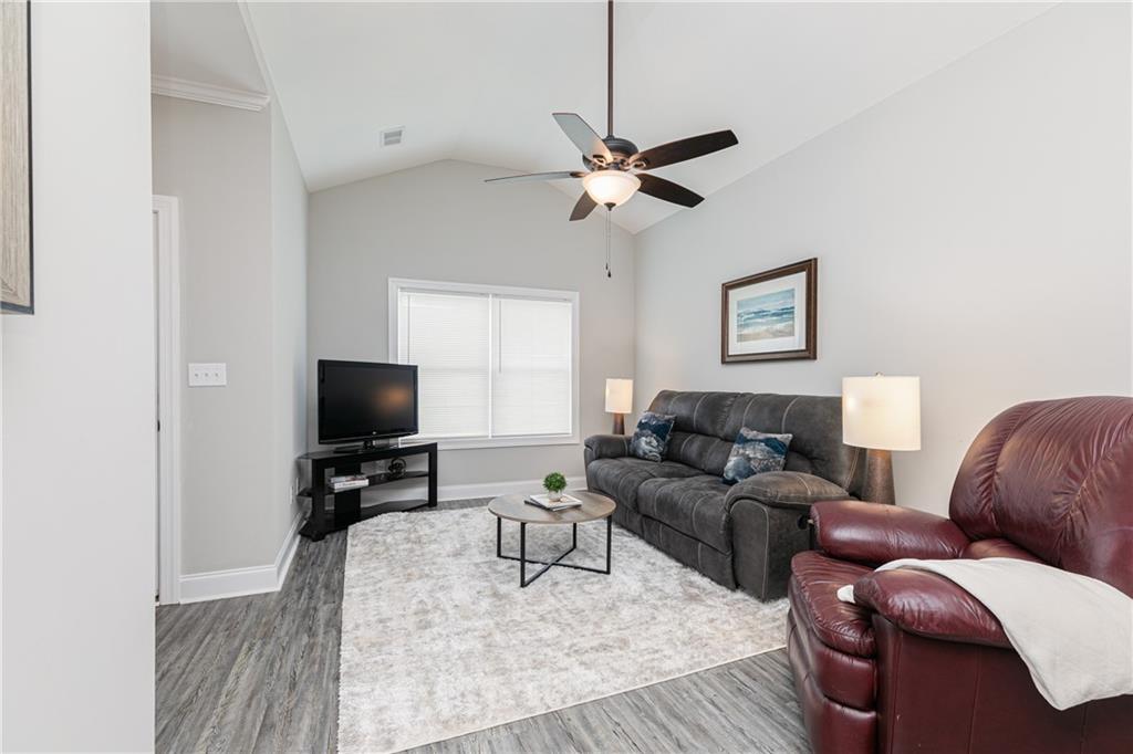 59 Calloway Lane Cartersville, GA 30120 - Photo 6 of 29 a living room with furniture a ceiling fan and a window