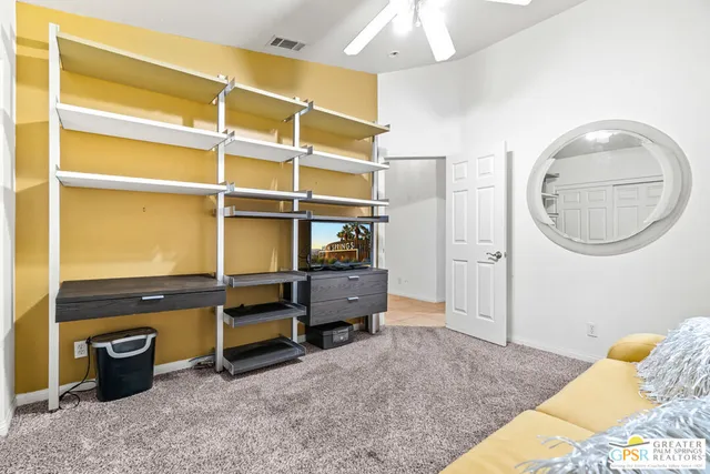 a bedroom with bed and a chandelier