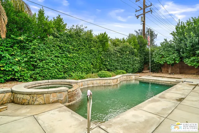 a view of a swimming pool with a patio