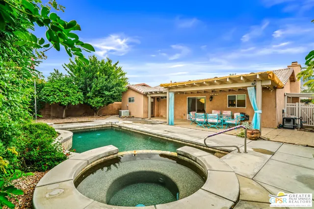 a house view with a sitting space and garden