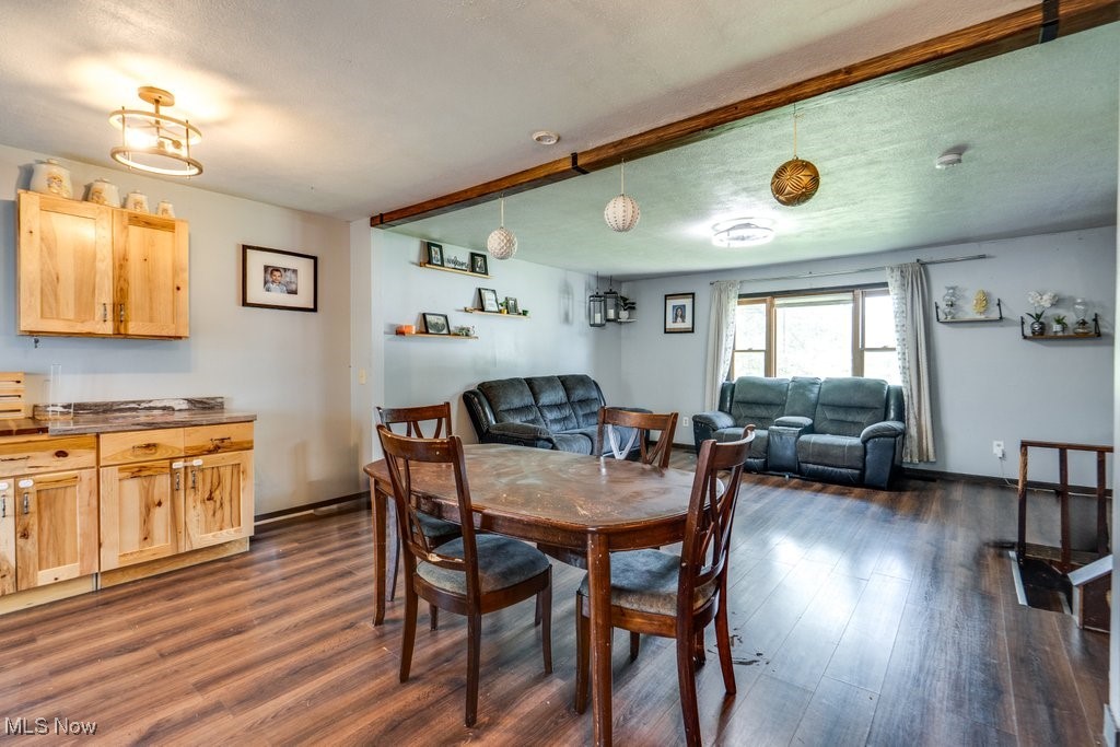 8998 Horn Road Windham, OH 44288 - Photo 10 of 34 Dining area with dark wood-style flooring and a textured ceiling
