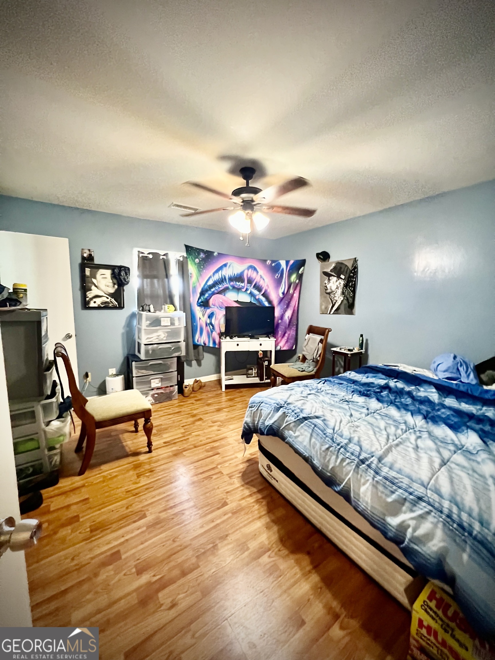 2618 Highway 86 Adrian, GA 31002 - Photo 16 of 27 a bed room with furniture and wooden floor