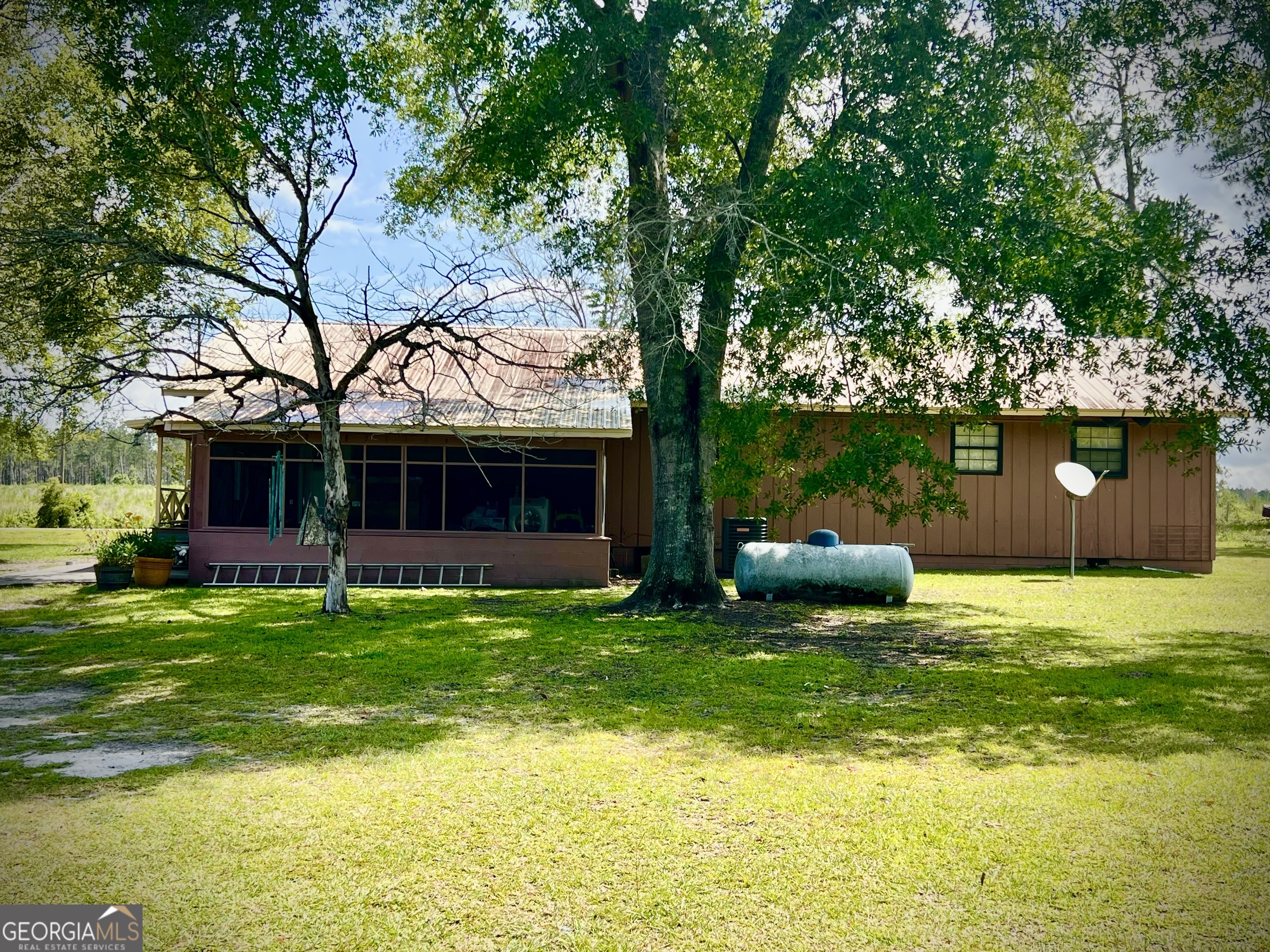 2618 Highway 86 Adrian, GA 31002 - Photo 3 of 27 a view of a couches in the patio with a yard