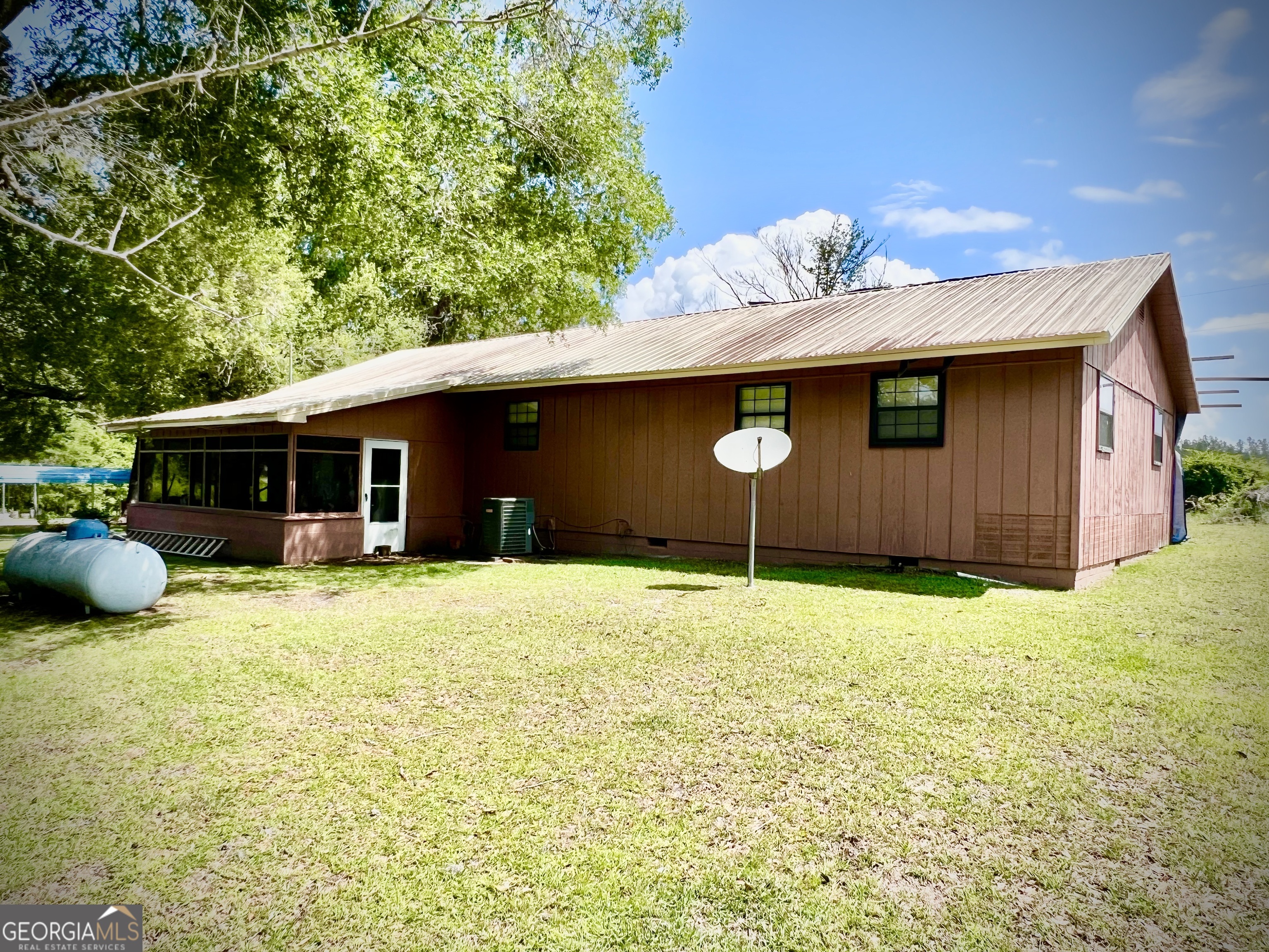 2618 Highway 86 Adrian, GA 31002 - Photo 4 of 27 a backyard of a house with table and chairs