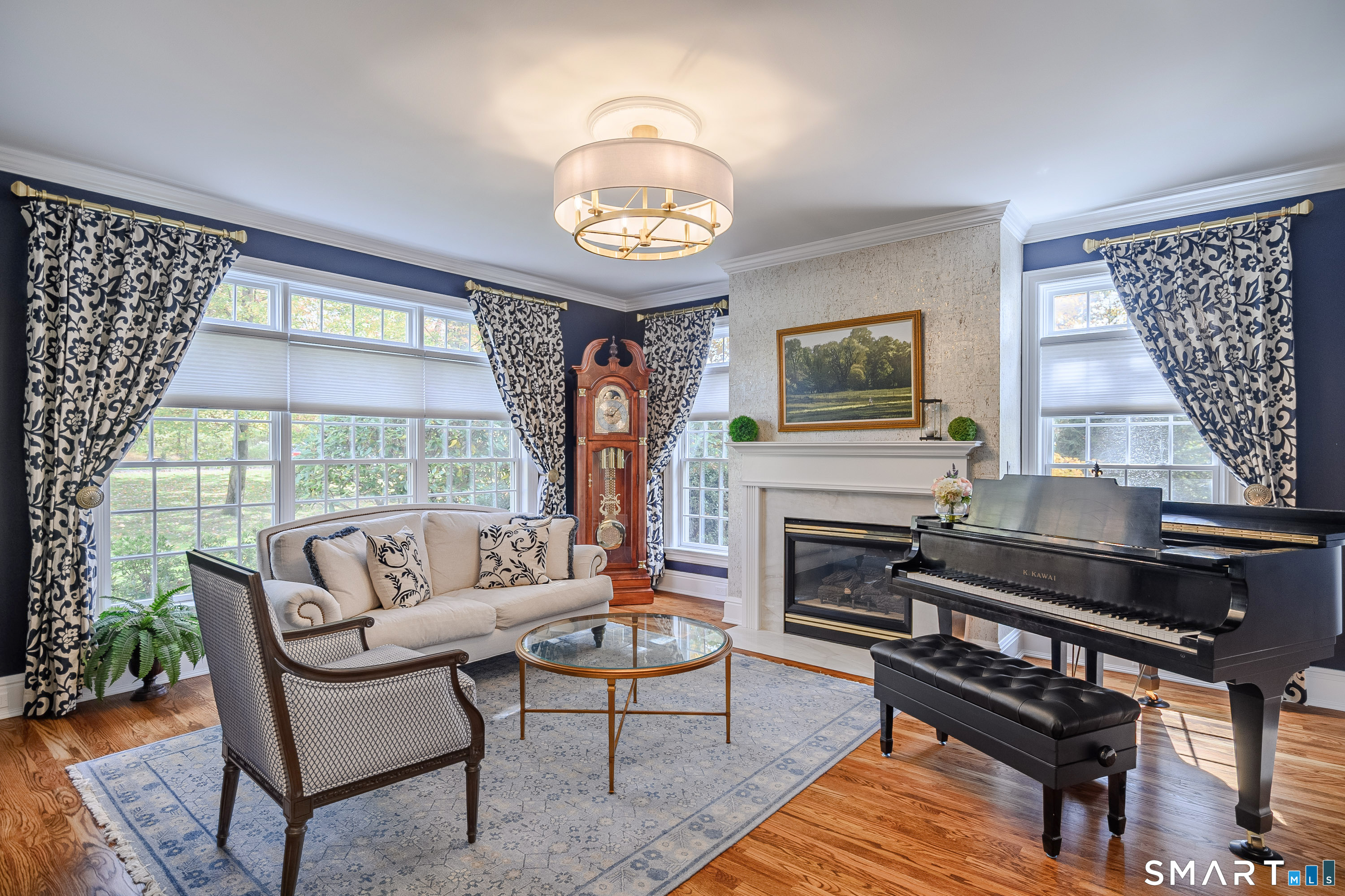 14 Merlins Lane Newtown, CT 06470 - Photo 12 of 40 Sun-filled living room with fireplace