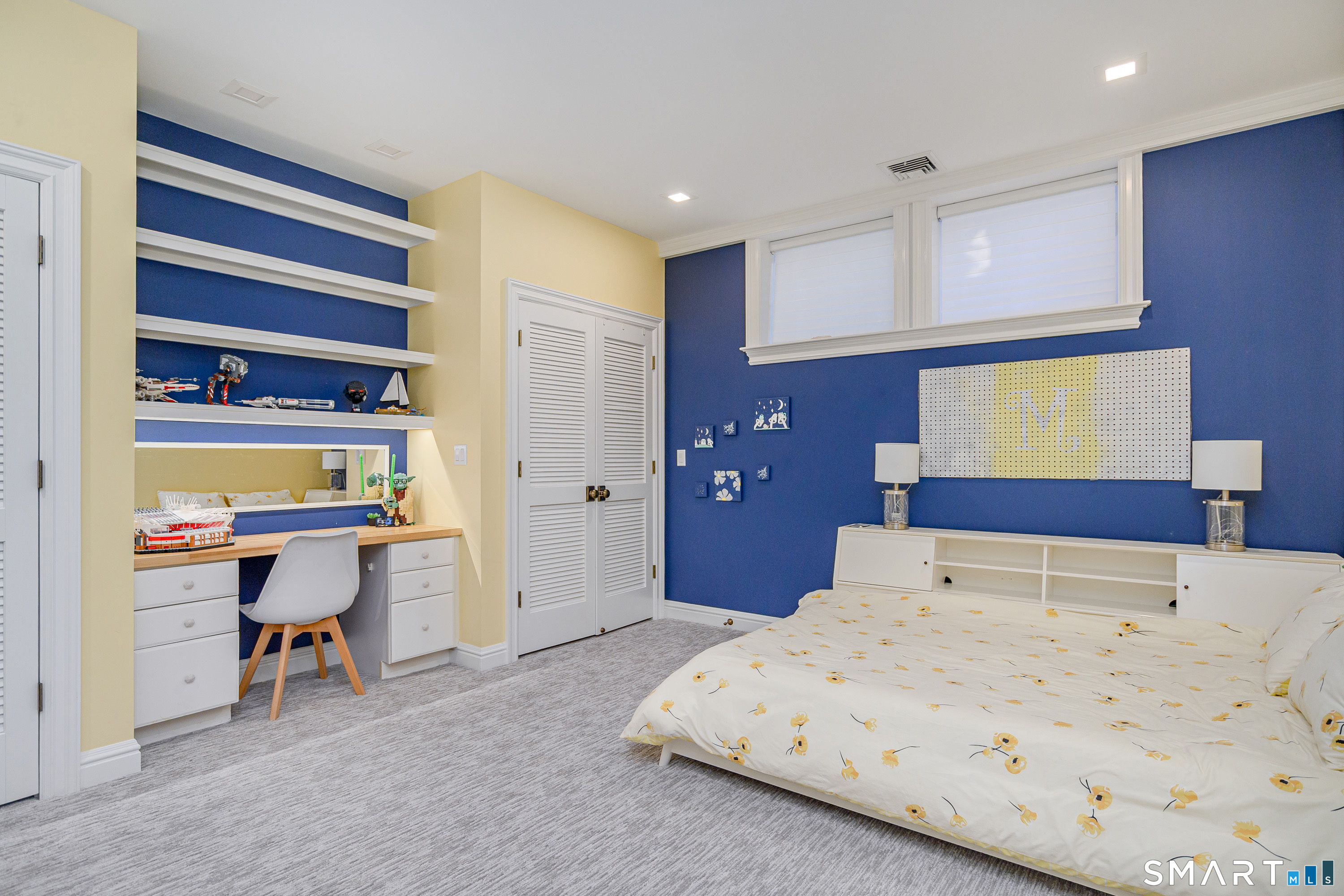 14 Merlins Lane Newtown, CT 06470 - Photo 29 of 40 Bright bedroom with built-in shelving, custom desk area, and generous closet space.