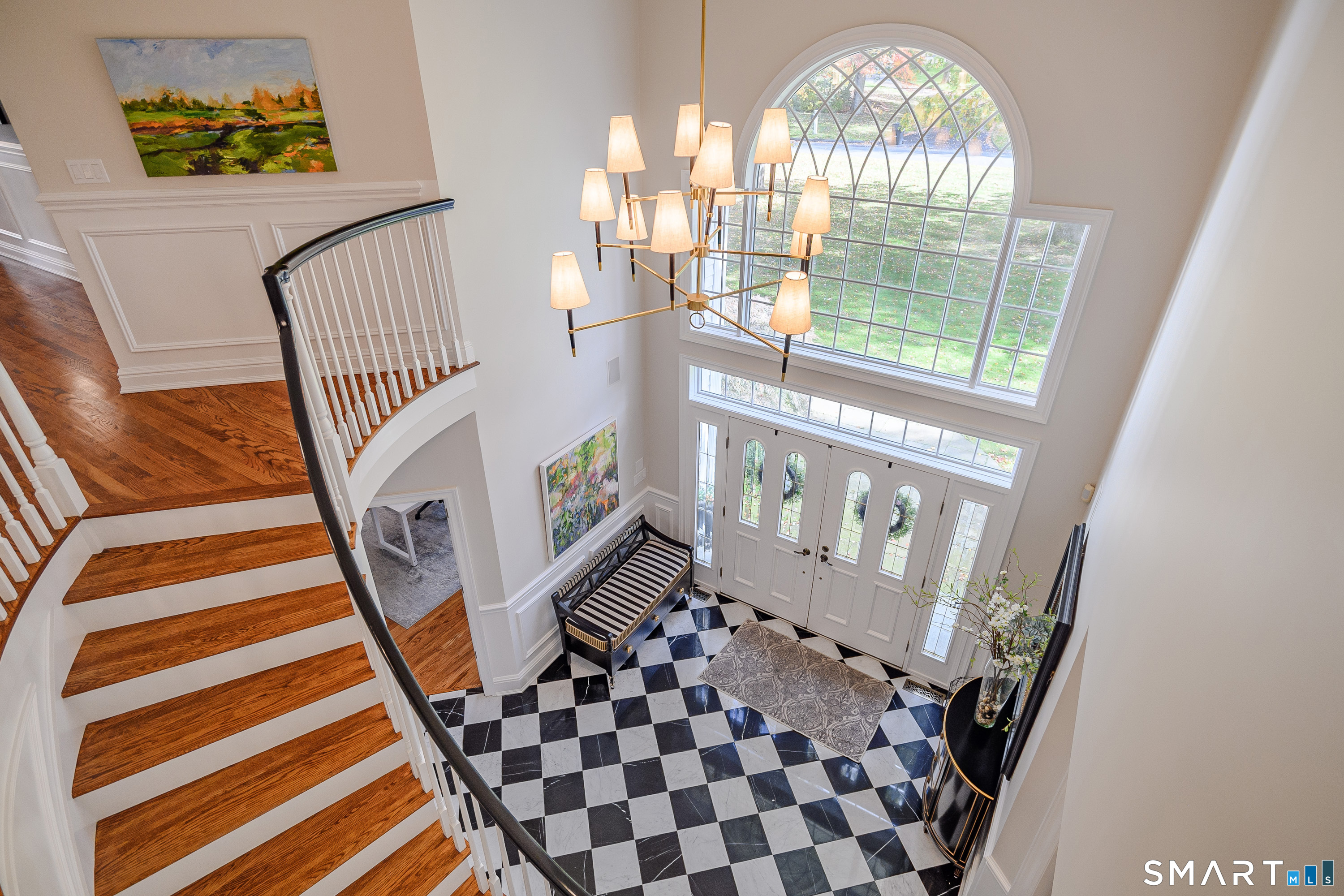 14 Merlins Lane Newtown, CT 06470 - Photo 3 of 40 Two-story foyer with curved staircase and marble flooring.
