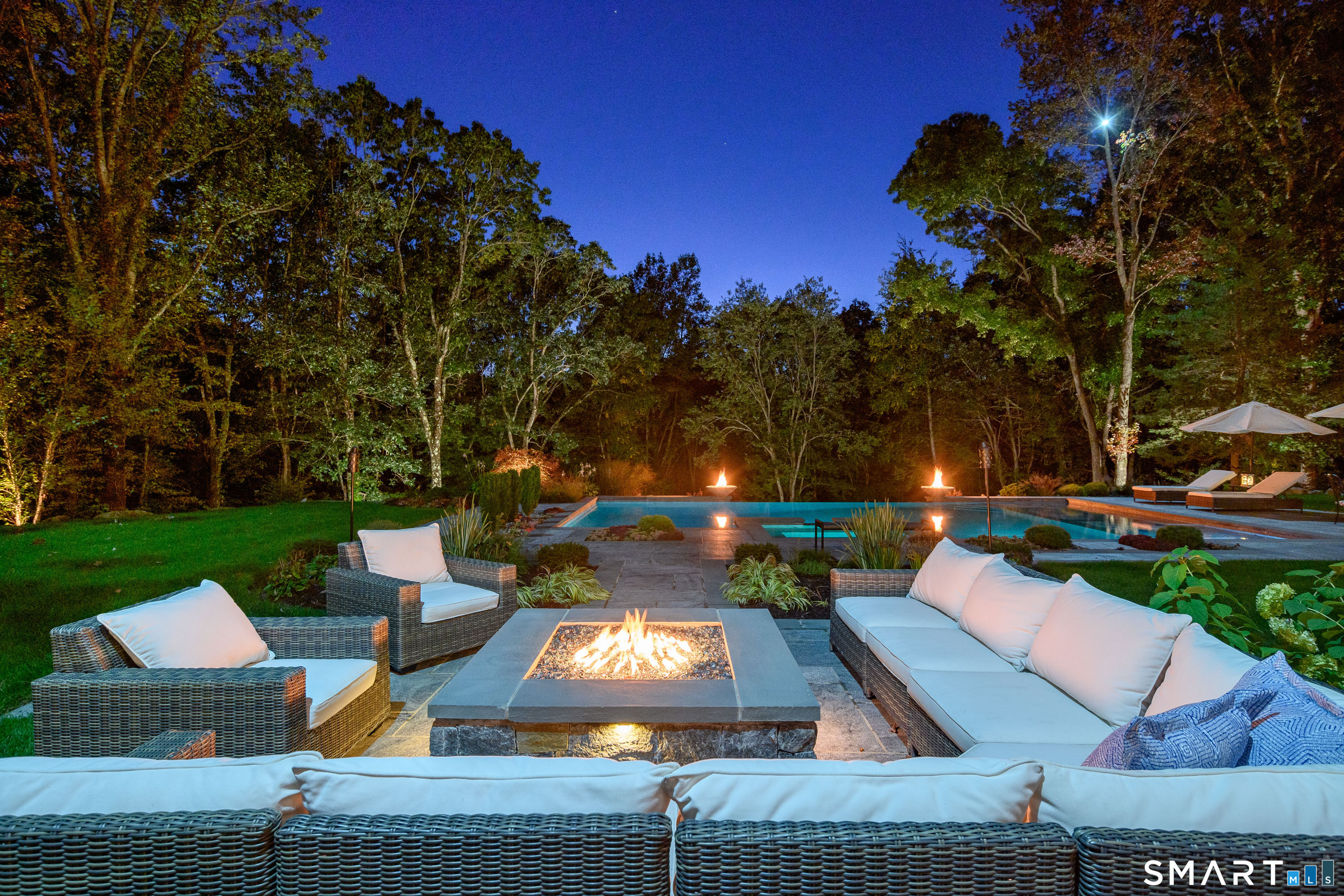 14 Merlins Lane Newtown, CT 06470 - Photo 39 of 40 Inviting fire pit seating overlooking the pool.