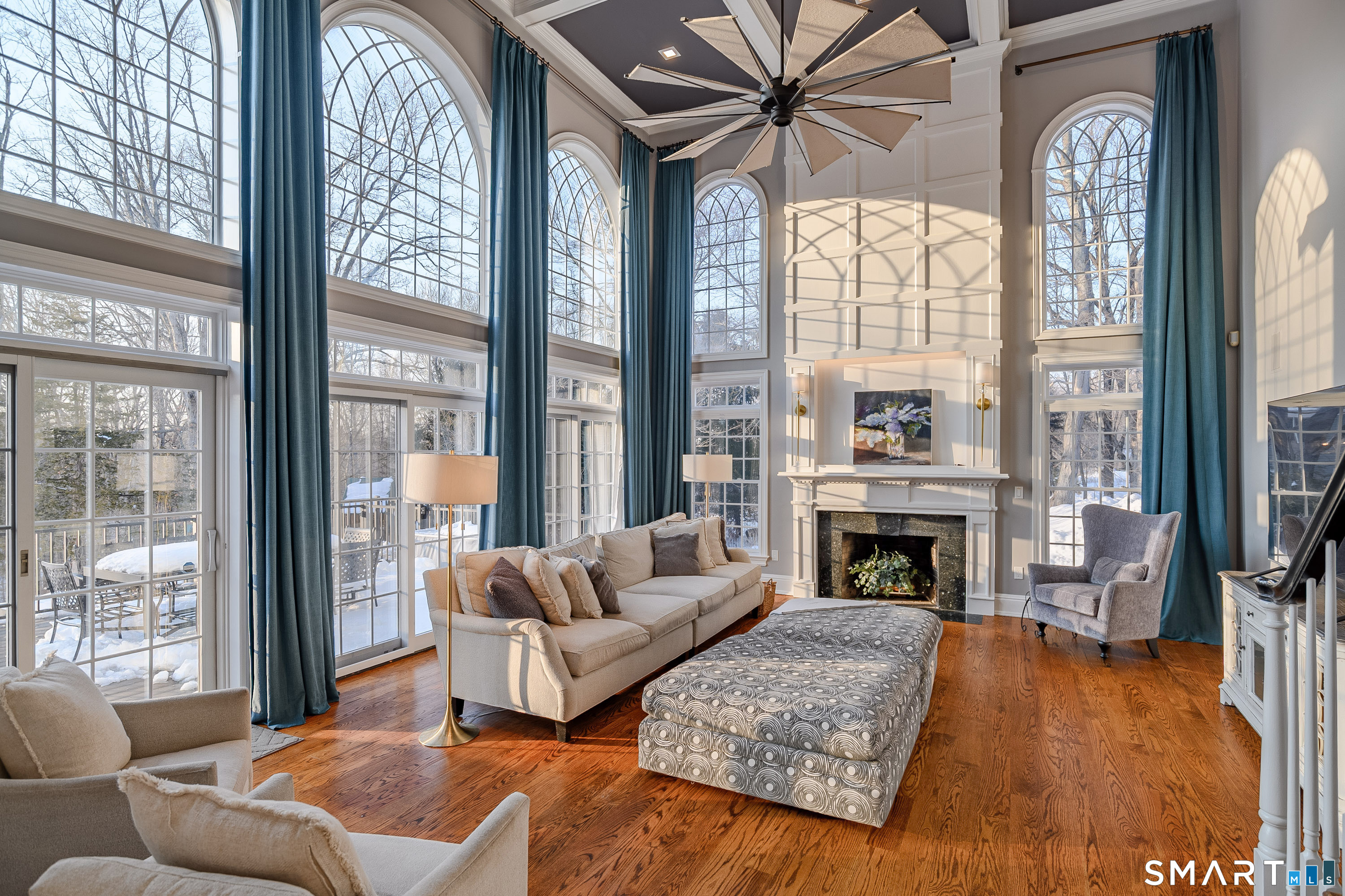 14 Merlins Lane Newtown, CT 06470 - Photo 6 of 40 Dramatic two-story family room with fireplace and arched windows.