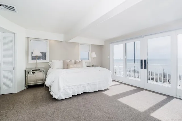 a spacious bedroom with a bed and closet