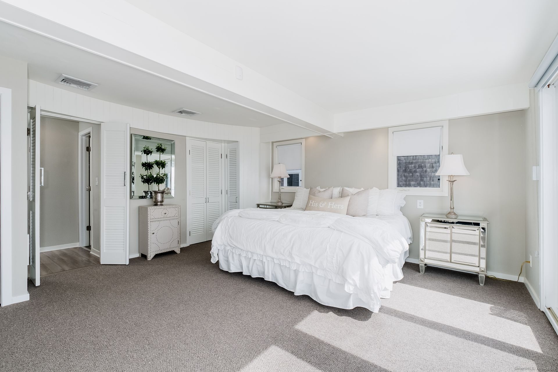 1987 Fairfield Beach Road Fairfield, CT 06824 - Photo 20 of 22 a spacious bedroom with a bed and closet