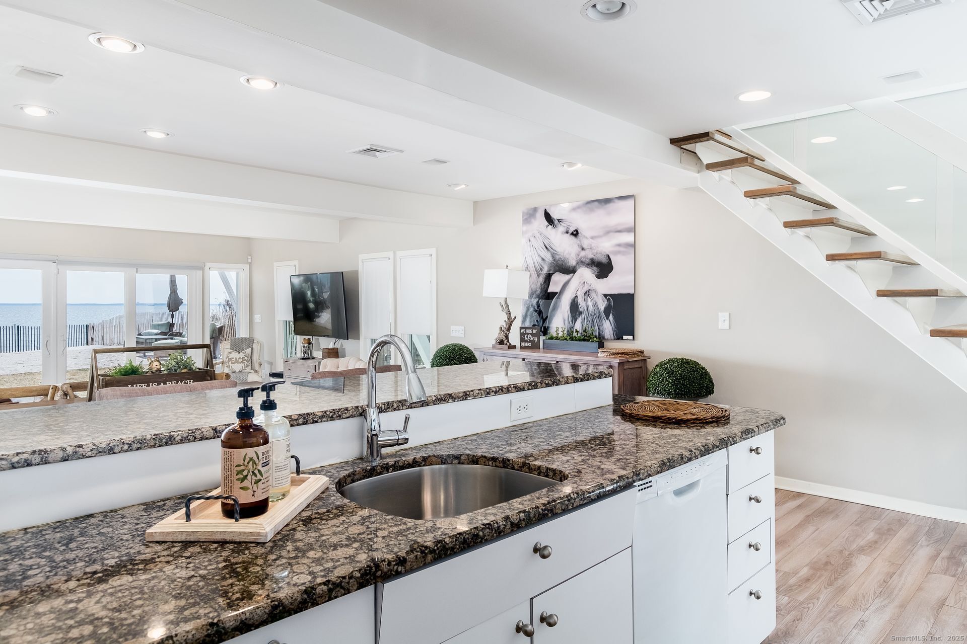 1987 Fairfield Beach Road Fairfield, CT 06824 - Photo 21 of 22 a kitchen with a sink and cabinets