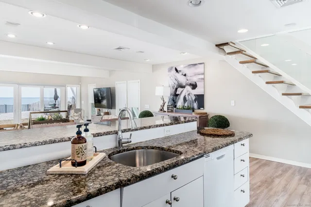 a kitchen with a sink and cabinets