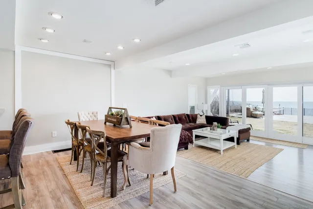 a view of a dining room with furniture wooden floor and chandelier