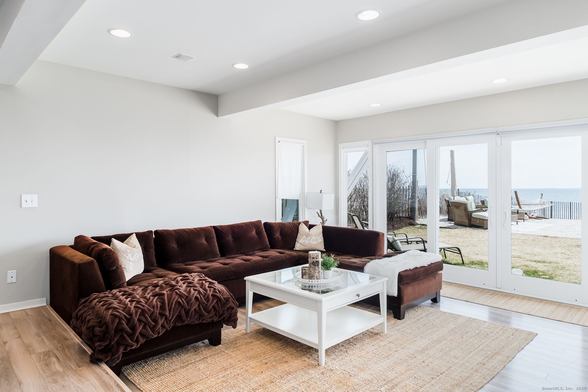 1987 Fairfield Beach Road Fairfield, CT 06824 - Photo 9 of 22 a living room with furniture and a table
