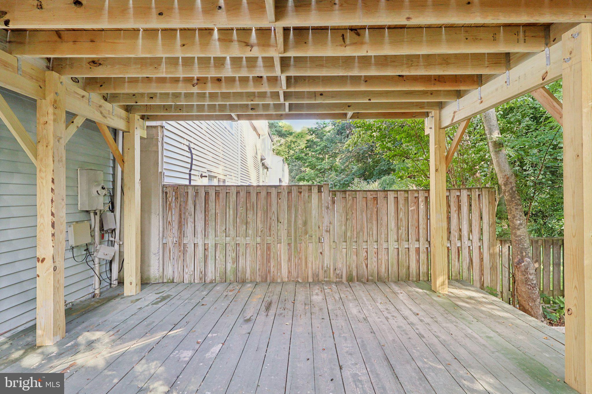 6246 Hillside Road Springfield, VA 22152 - Photo 33 of 41 a view of outdoor space with wooden floor and plants