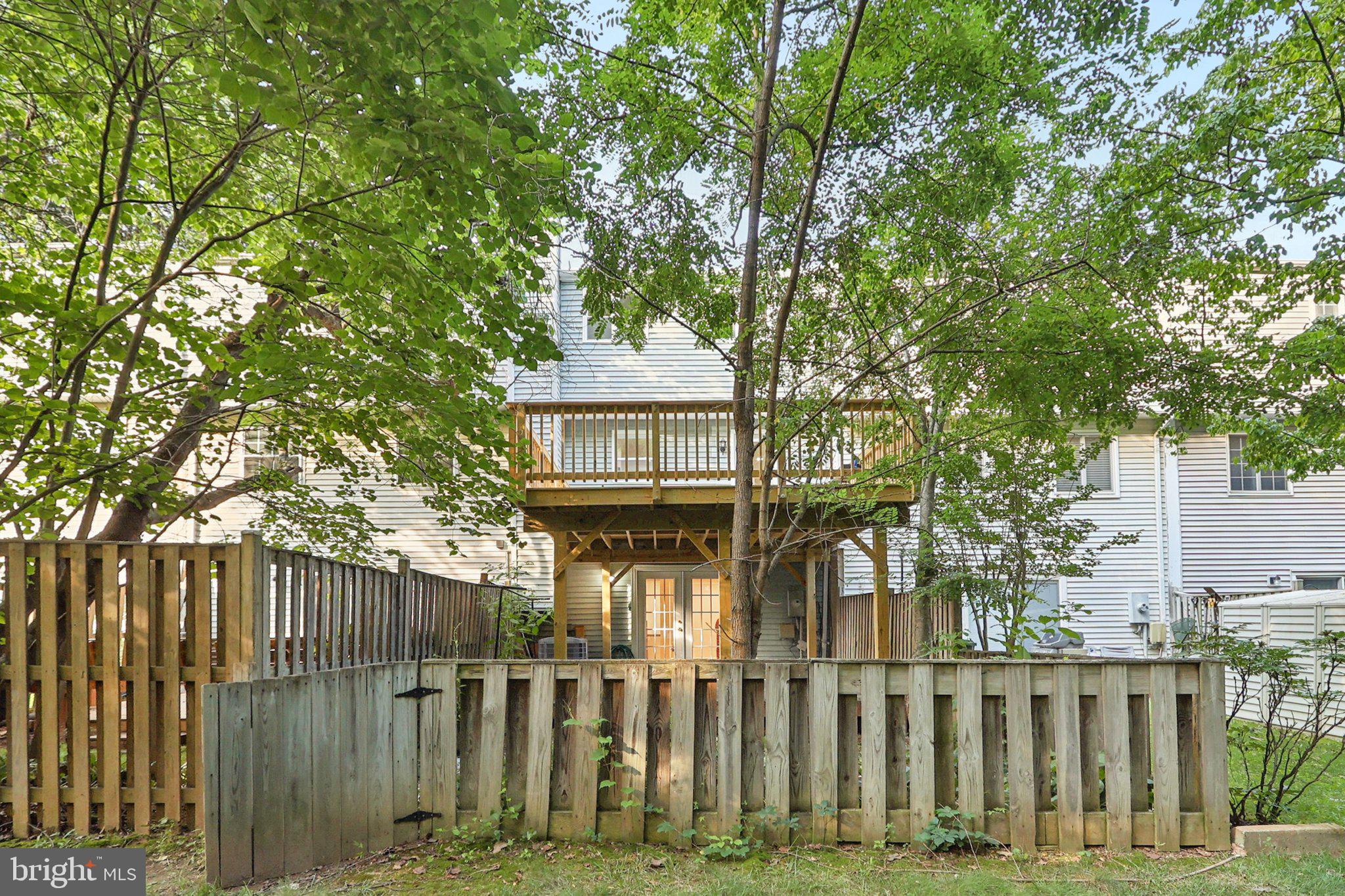 6246 Hillside Road Springfield, VA 22152 - Photo 35 of 41 a front view of a house with a garden