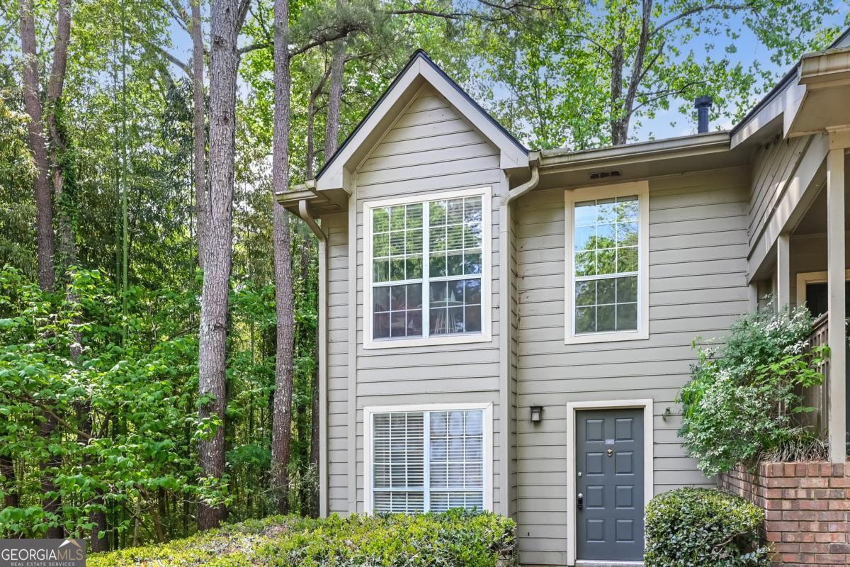 201 Lenox Way Northeast, Unit 201 Atlanta, GA 30324 - Photo 1 of 15 front view of a house with a yard
