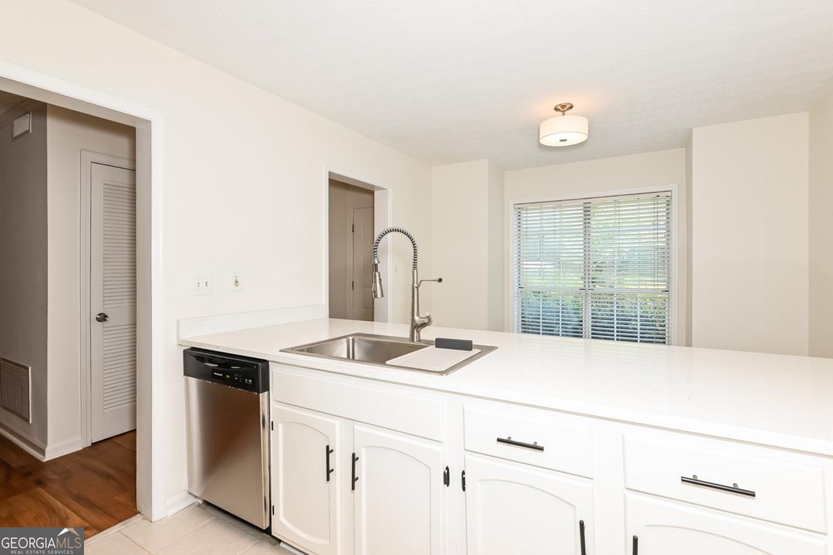 201 Lenox Way Northeast, Unit 201 Atlanta, GA 30324 - Photo 7 of 15 a close view of sink and tap