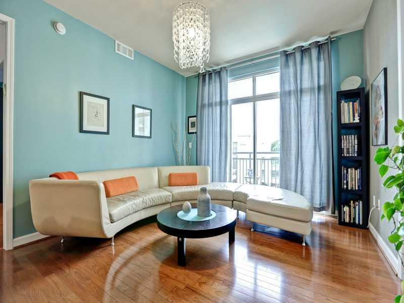 711 Cosmopolitan Drive Northeast, Unit 426 Atlanta, GA 30324 - Photo 1 of 1 a living room with furniture and a large window