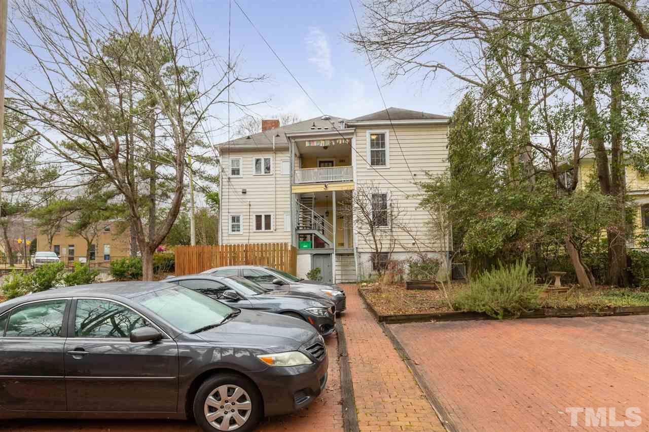 112 Forest Road Raleigh, NC 27605 - Photo 1 of 14 a front view of a house with parking space